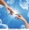 stock-photo-man-s-and-woman-hand-against-the-sky-66158704.jpg