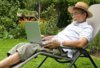 3416054-senior-in-garden-at-leisure-with-laptop-computer[1].jpg