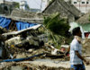 destroyed-car-and-houses.jpg