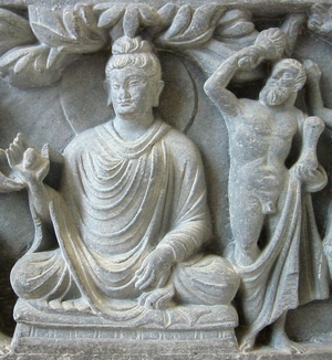 Herculean depiction of Vajrapani (right), as the protector of the Buddha, 2nd century AD